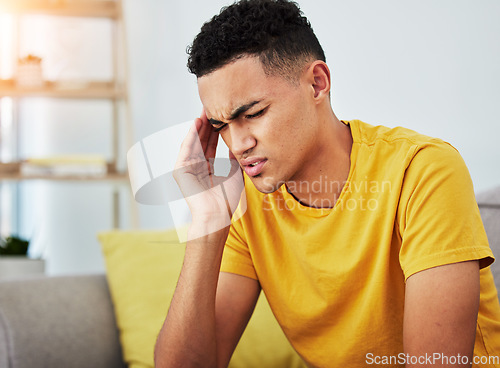 Image of Headache, stress and student with man on sofa for pain, burnout and tired. Fatigue, mental health and frustrated with face of male person in living room at home for anxiety, exhausted and migraine