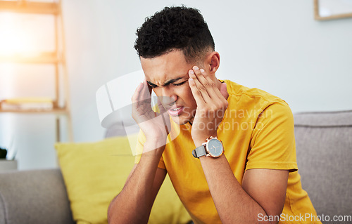 Image of Headache, stress and tired with man on sofa for pain, burnout and student. Fatigue, mental health and frustrated with face of male person in living room at home for anxiety, exhausted and migraine