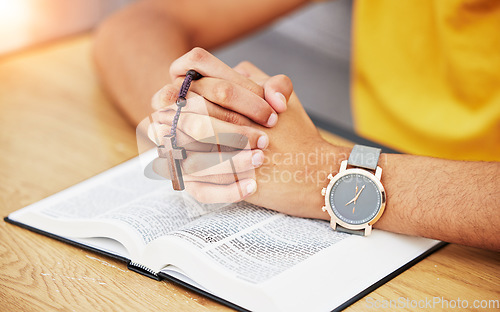 Image of Prayer, worship and bible with hands of person in living room for peace, spiritual and Christian. Hope, God and belief with closeup of man with holy book at home for religion, praying and gratitude