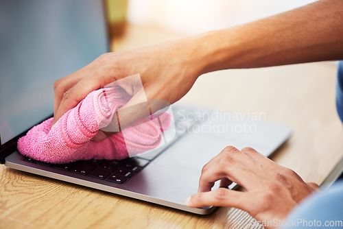 Image of Hands, wipe and laptop with dust, cleaning and hygiene with a cloth, washing or bacteria. Pc, person or worker with fabric, keyboard or covid compliance with technology, antibacterial or disinfection
