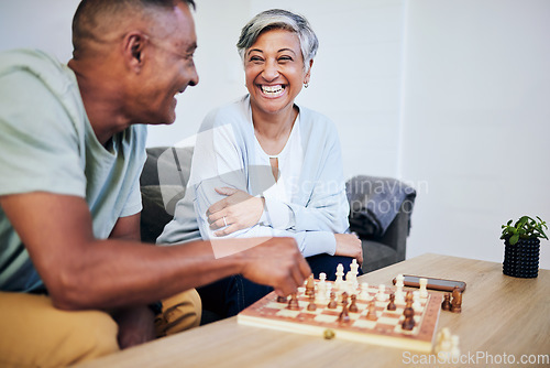Image of Senior couple, playing chess and home for thinking, strategy or mindset with excited smile, relax or bonding. Elderly woman, man and sofa for board game, ideas or brainstorming for challenge in house