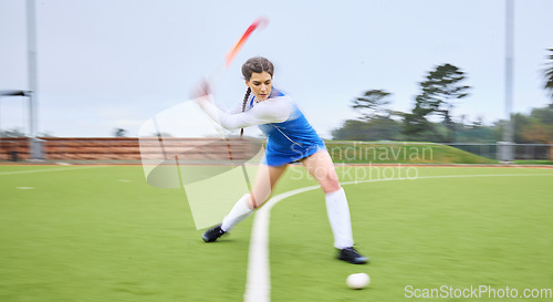 Image of Sports, hockey and female athlete training for a game, match or tournament on an outdoor field. Fitness, exercise and young woman playing at practice for strategy with a stick and ball at a stadium.