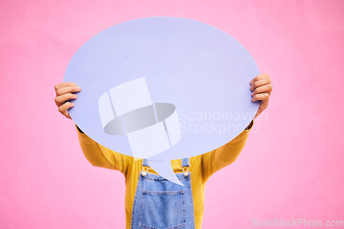 Image of Hands, speech bubble and quote on social media, mockup or opinion, review and space for feedback or advertising on pink background. Studio, dialogue and communication sign or banner for a chat