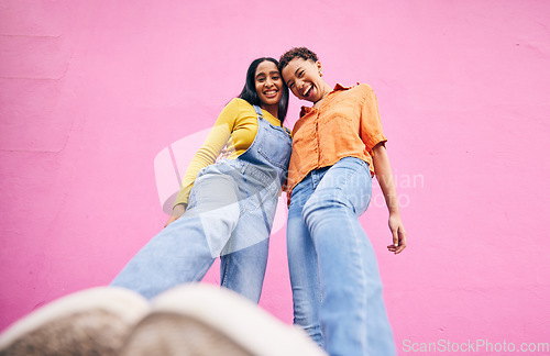 Image of Selfie, fashion and portrait of friends on pink background in city with trendy clothes, stylish and cool outfit. Happy, creative and below of female people for freedom on holiday, vacation or weekend