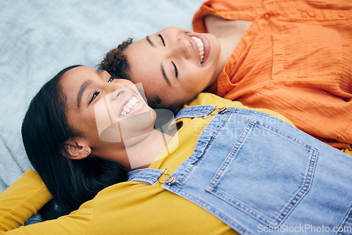 Image of Lesbian, couple and women in a park happy with freedom, care and bonding on picnic outdoor. Gay, love and face of queer female partners on a blanket in a forest smile, talking and enjoying weekend