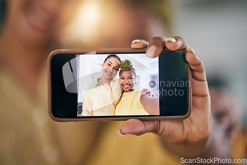 Image of Lesbian couple, women and selfie with phone screen in home in portrait, post and web blog in living room. African girl, photography and memory with profile picture, lgbtq or social media app in house