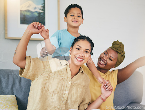 Image of Airplane, love and gay couple with boy child on a sofa for foster, bonding and playing in their home together. Lesbian, mothers and cheerful kid with parents in living room for piggyback fun games