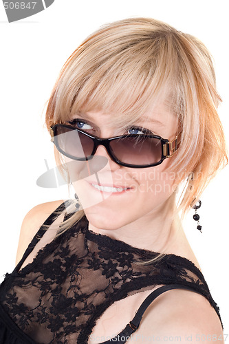 Image of The blonde in sunglasses with a crafty sight. Isolated