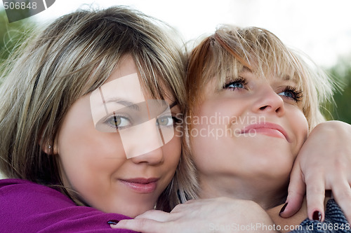 Image of Portrait of the two smiling young women outdoors