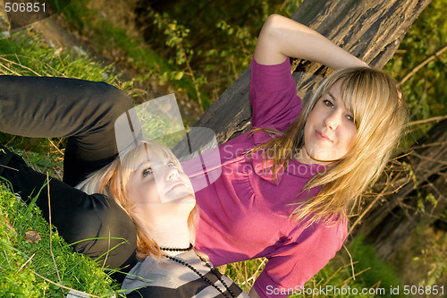 Image of Two happy beauty young blonde outdoors