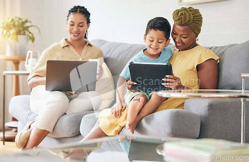 Image of Laptop, tablet and happy family child, mom or bisexual people reading online info, e learning and remote education. Tech app, lesbian mothers and relax gay woman teaching kid on home living room sofa