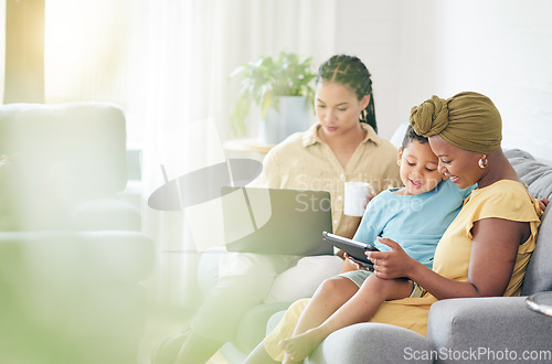 Image of Reading kid, tablet and family home, mom and bisexual people search social media, studying e learning and ebook story. LGBTQ, online knowledge app or relax non binary woman teaching child on sofa