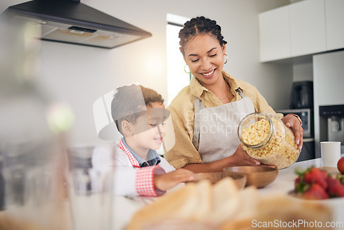 Image of Breakfast, smile and a mother and child cooking, baking or helping with food in the kitchen. House, eating and a boy kid and a young mom teaching during lunch or for dinner together while hungry