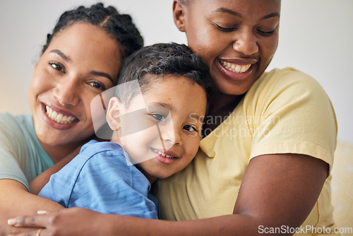 Image of LGBT, hug and face of family portrait, happy kid and mothers love, affection and enjoy bonding time together. Home, closeup and gay people, non binary parents or lesbian women embrace adoption child