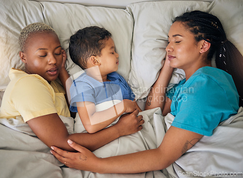 Image of Sleeping, gay family and relax in bed from above, hug and resting in their home together. Lgbt, sleep and lesbian couple with foster boy child in bedroom dreaming, care and adoption, comfort and love