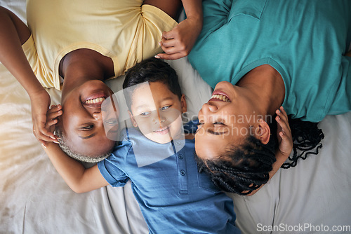 Image of Child, LGBT family and happy on bed in home bedroom for security, quality time and love. Adoption, lesbian or LGBTQ women or parents with a foster kid for care, fun and relax in morning from above