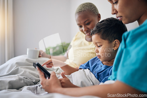 Image of Tablet, bed and gay mother, child and bisexual people reading online story, digital information and home ebook. LGBTQ, streaming video and queer mom, family or parents storytelling for kid in bedroom