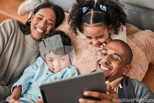 Image of Family, children and parents on tablet for movie, film or cartoon streaming on internet subscription and living room floor. Home, selfie and happy mom, dad and kids watch on digital technology