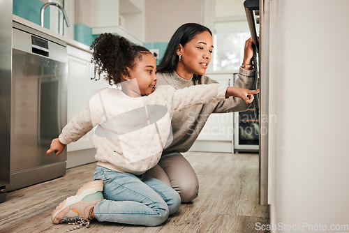 Image of Oven, teaching and parent cooking with child in kitchen for development, care and learning a recipe together at home. Stove, curious and kid help mom or mother prepare food, meal or baking in house