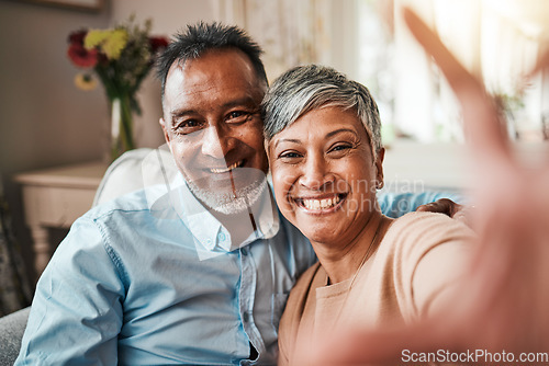 Image of Senior couple, selfie and happy on home sofa with a smile, happiness and love. Mature man and woman relax together on a couch for profile picture, social media and commitment or memory of marriage