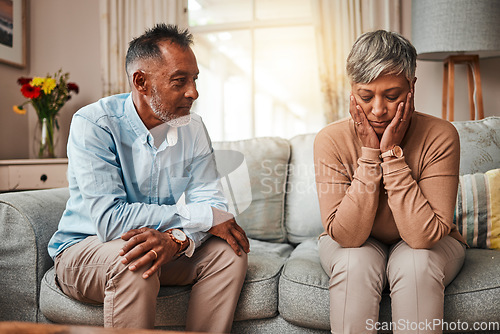 Image of Angry, senior couple and fight on couch, conflict and depression with a breakup, cheating or stress. Divorce, old woman or elderly man with mental health, home or separation with crisis or retirement