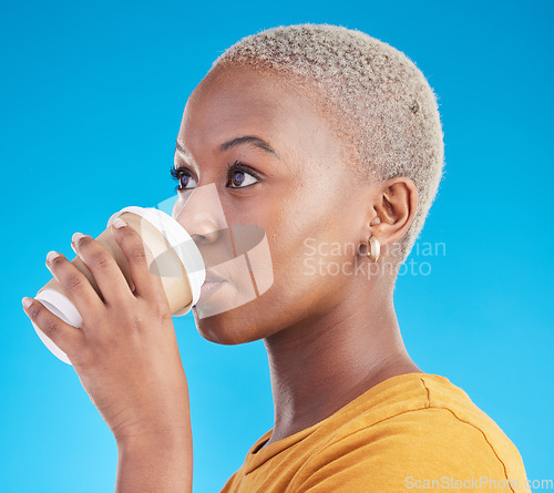 Image of Thinking, drink or black woman with coffee on blue background to relax, chill and enjoy a beverage. Cappuccino latte, idea or African girl on break with tea, caffeine or vision of future in studio