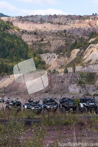 Image of Various ATV quad motors in the forest area ready for adventurous driving