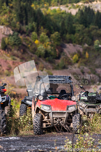 Image of Various ATV quad motors in the forest area ready for adventurous driving