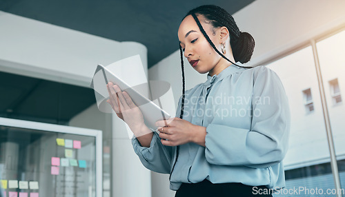 Image of Woman in office on tablet, research and checking email with sticky note ideas on moodboard, business plan and brainstorming. Thinking, reading web and businesswoman on digital app for online review.