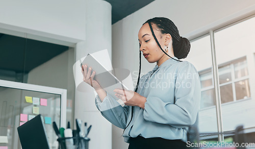 Image of Tablet, reading and business woman at web analyst company with typing. Technology, female person and online professional working in a office with computer and digital data research for project