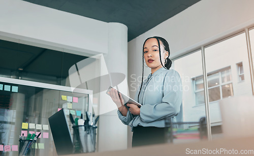 Image of Low angle portrait of woman in office on tablet, research and sticky note ideas on moodboard for business plan. Internet, confidence and businesswoman on digital app for online review at startup.