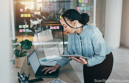 Image of Tablet planning, laptop and business woman at web analyst company with typing. Technology, female person and online professional working in office with computer and digital data research for project