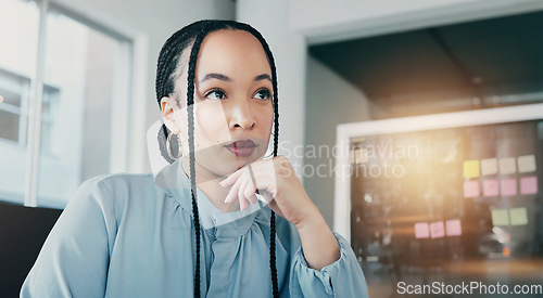Image of Thinking, corporate and a woman in an office workspace for planning, ideas or a business vision. Young, working and a worker, employee or girl at a company for marketing job or career solution