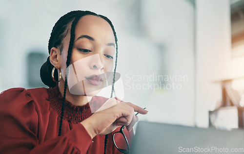 Image of Laptop, business and a designer woman in her office for research on a creative online project. Computer, website and innovation with young female employee in her workplace for internet or web design