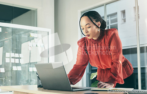 Image of Woman in office on laptop, research and brainstorming on website for business plan, ideas or proposal process. Thinking, internet search and businesswoman on computer with online notes at startup.