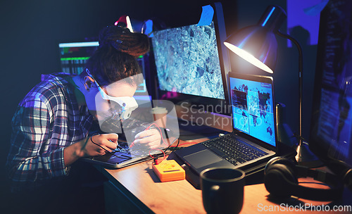 Image of Woman, computer technician and motherboard with circuit, electronics or soldering iron with goggles in lab. Information technology, maintenance and programming for future, hardware or system in night