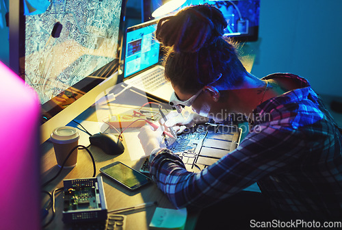 Image of Woman, electronics technician and motherboard with soldering iron for microchip repair. Information technology, circuit board and a person programming for future hardware or system upgrade at night