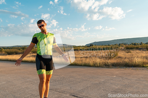 Image of A triathlete resting after a hard morning's run. Training preparation for the upcoming marathon