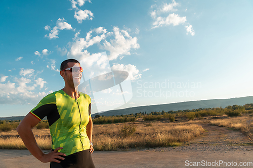 Image of A triathlete resting after a hard morning's run. Training preparation for the upcoming marathon