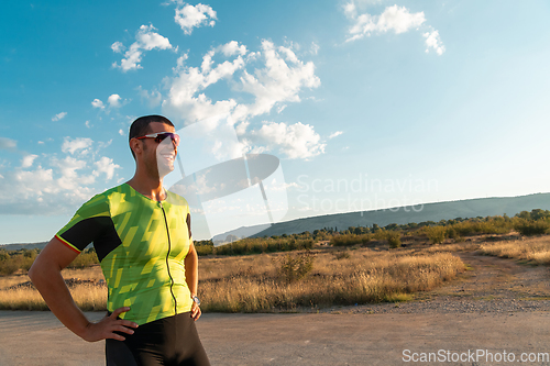 Image of A triathlete resting after a hard morning's run. Training preparation for the upcoming marathon