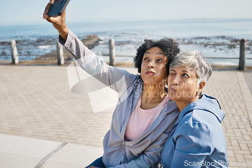 Image of Senior fitness, selfie and women at the beach for workout, wellness and morning cardio in nature. Healthy retirement, social media and friends at sea for profile picture, photo or exercise memory