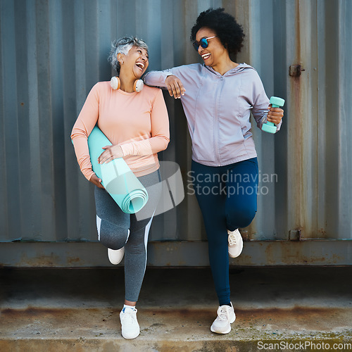 Image of Senior women, exercise and laughing, cool and urban with workout equipment, friends and fun training together. Active female people, fitness fashion and yoga mat with dumbbell, sportswear and comedy