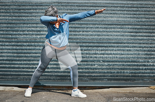 Image of Woman, fitness and dab dance outdoor at training, exercise or workout achievement with celebration. Mature runner lady, comic dancing and winner in city with mindset, freedom or commitment to health