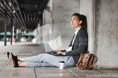 Image of Thinking, laptop and woman on a coffee break in the city or employee typing on social media, internet or online job search. Unemployed, worker and networking on computer for hiring opportunity