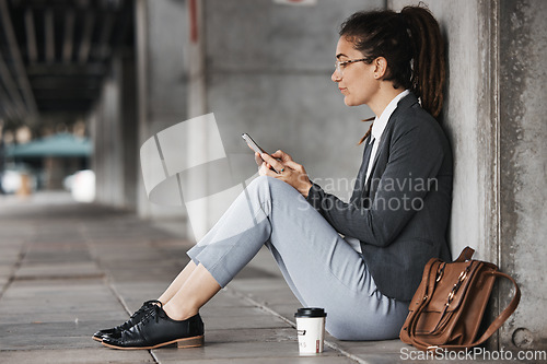 Image of Woman, reading and phone on coffee break in the city, street or employee relax on social media, internet or online job search. Unemployment, news and worker sitting to check email on cellphone