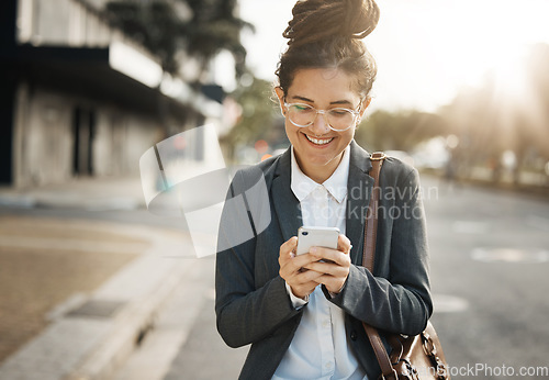 Image of Business, road and woman with a cellphone, typing and travel with internet connection, mobile app and smile. Female person, outdoor and happy employee with a smartphone, social media and happiness