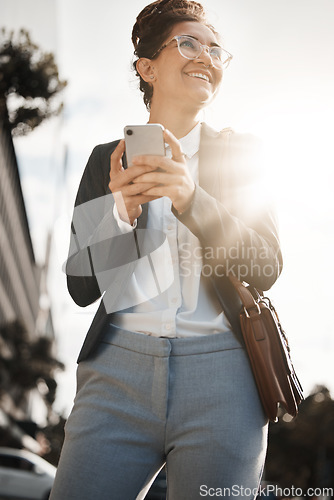 Image of Employee, city and woman with a smartphone, smile and email with internet connection, social media and lens flare. Worker, travel or business person with a cellphone, mobile app or sms with happiness