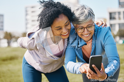 Image of Senior woman, friends and outdoor with phone or social media, blog or reading post about workout, exercise and walk in park. Elderly person, people and check profile picture together on screen