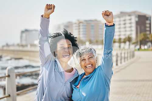 Image of Fist pump, women and portrait, fitness success and senior friends with winning and workout goals outdoor. Team, happiness and female people with cheers, exercise together at beach and celebration