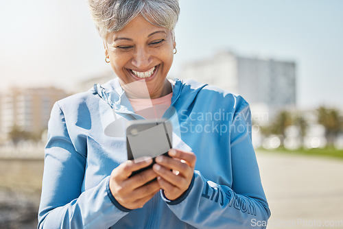 Image of Fitness, outdoor and senior woman with cellphone, typing and social media with connection, network and happiness. Happy person, pensioner and old lady with a smartphone, smile and contact with health